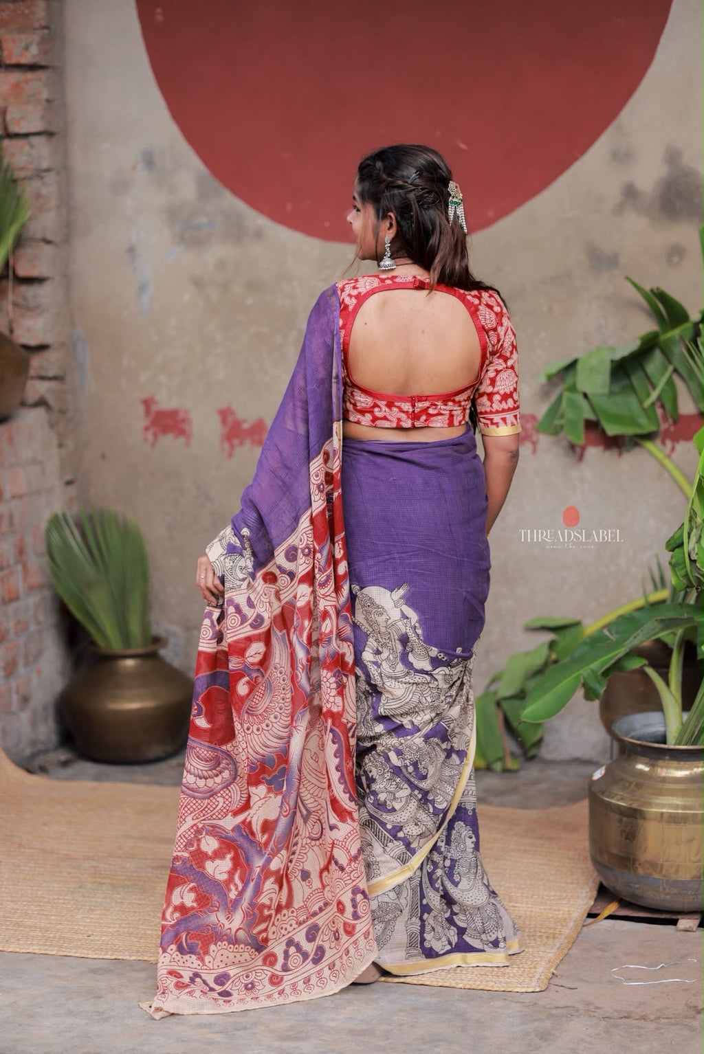 Purple kota saree with kalamkari work blouse