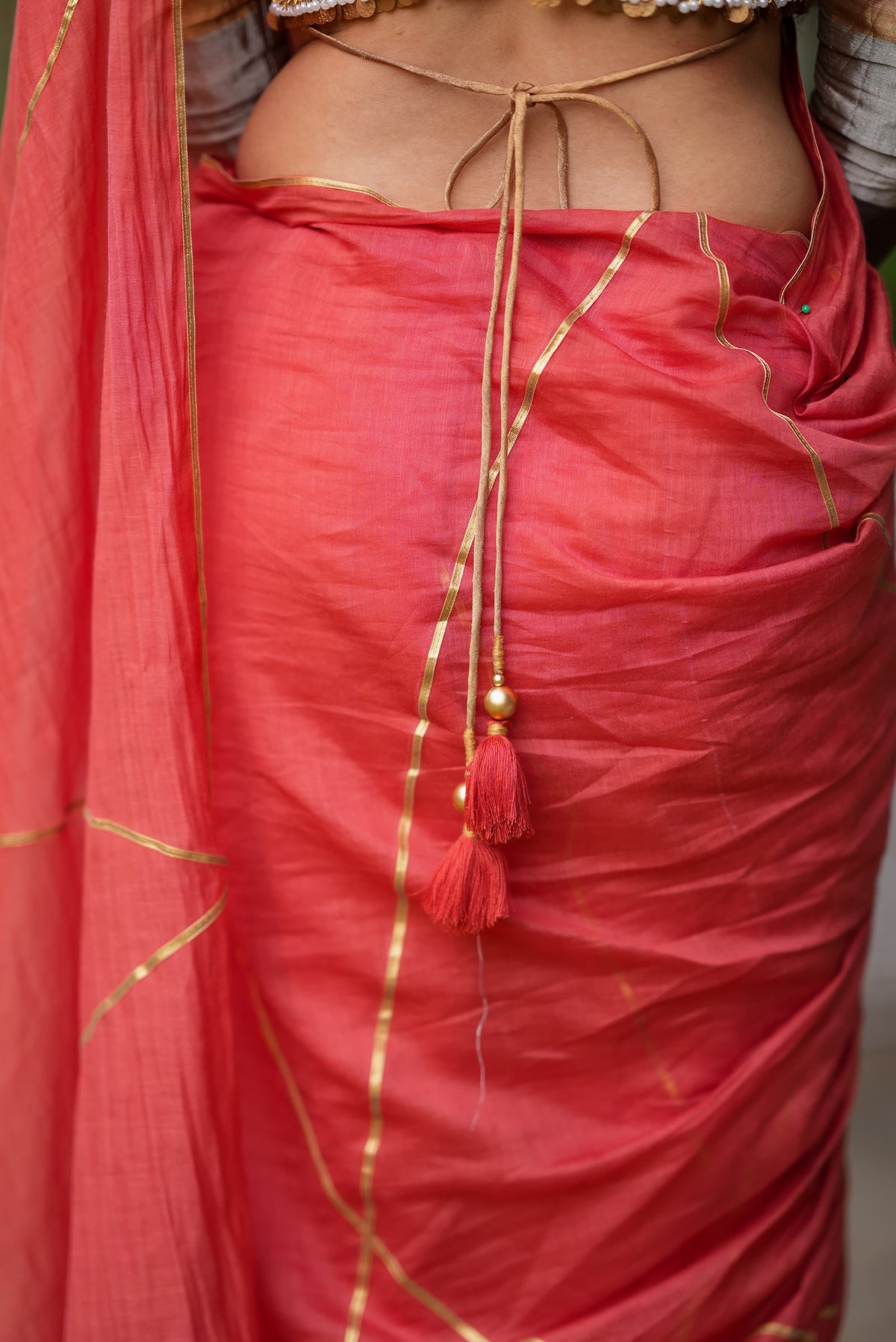 Orange rust saree with tissue handwork blouse
