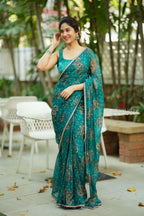 Peacock blue organza saree with velvet blouse