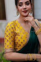 Green organza saree with yellow hand work blouse