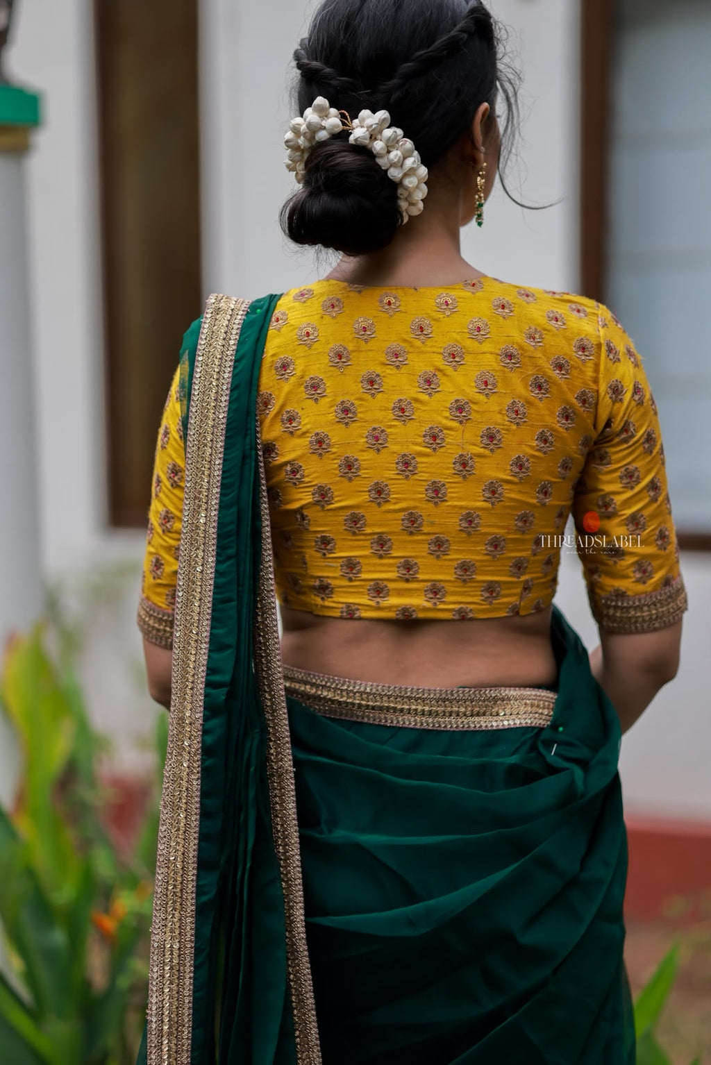 Green organza saree with yellow hand work blouse