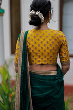 Green organza saree with yellow hand work blouse