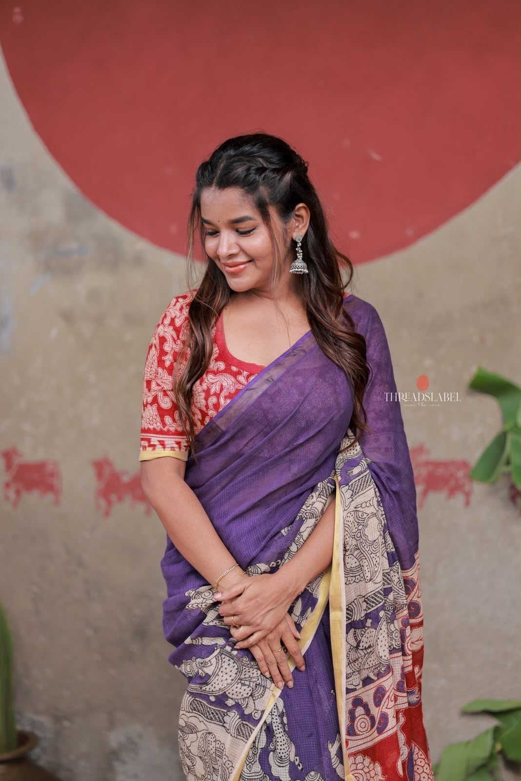 Purple kota saree with kalamkari work blouse