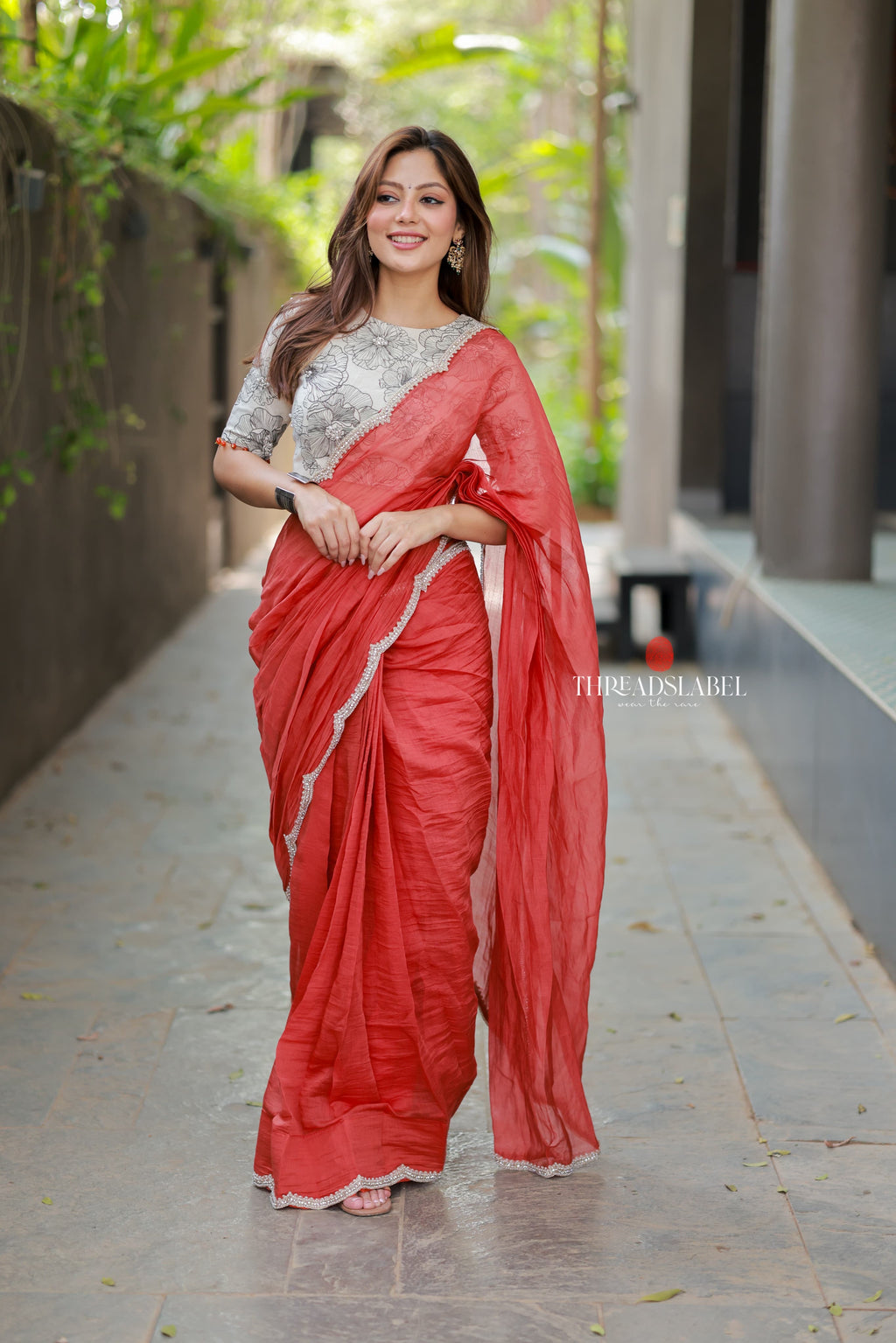 Orange rust saree with pearl work blouse