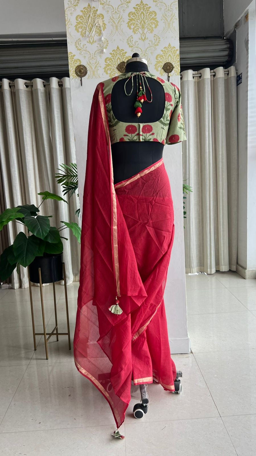 Maroon pure kota saree with green hand work blouse