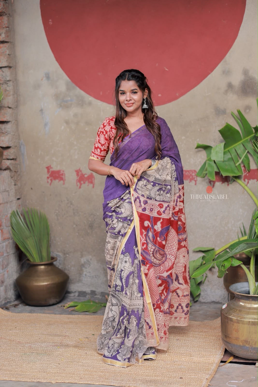 Purple kota saree with kalamkari work blouse
