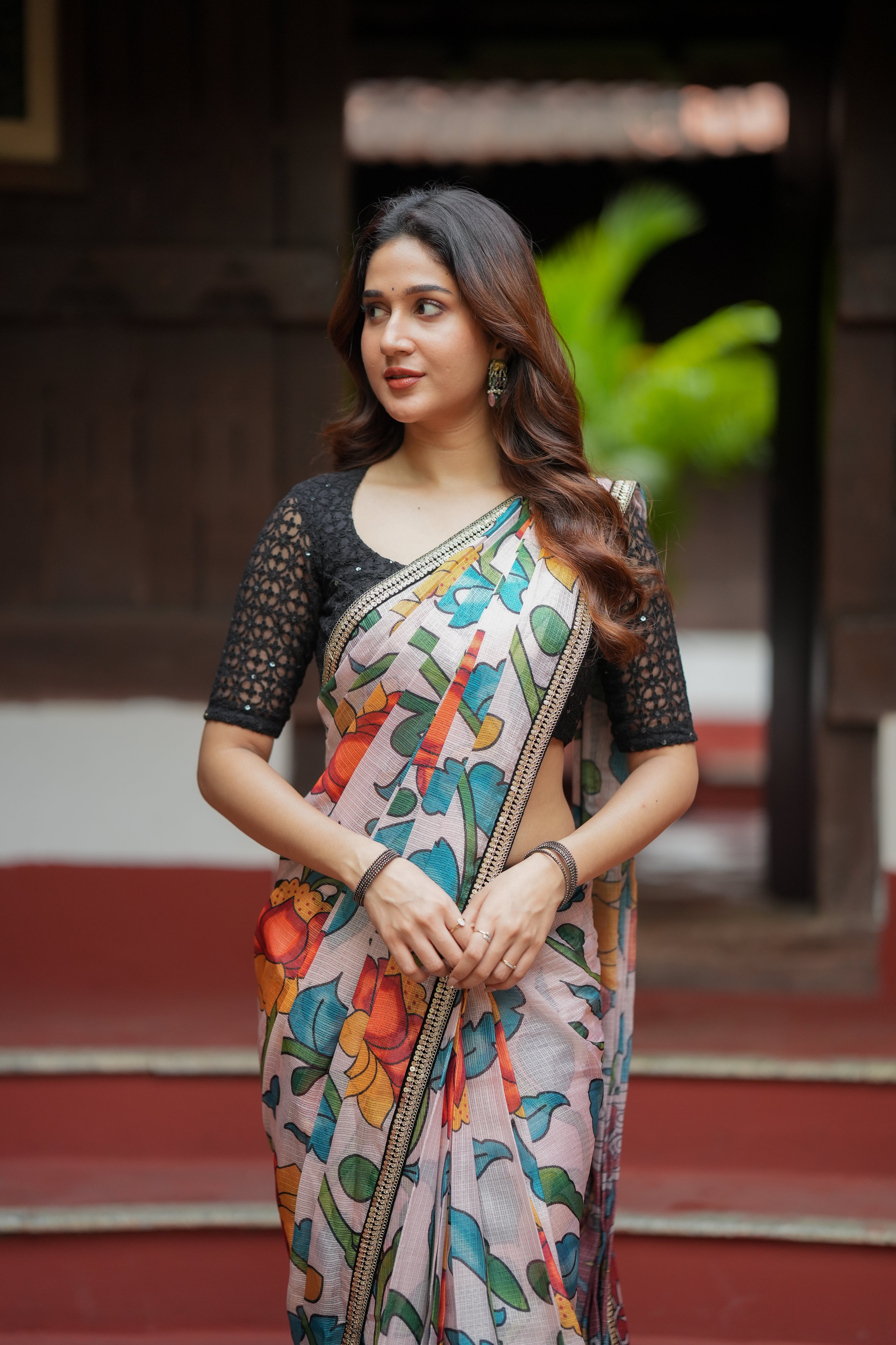 Half white floral kota saree with black embroidered blouse