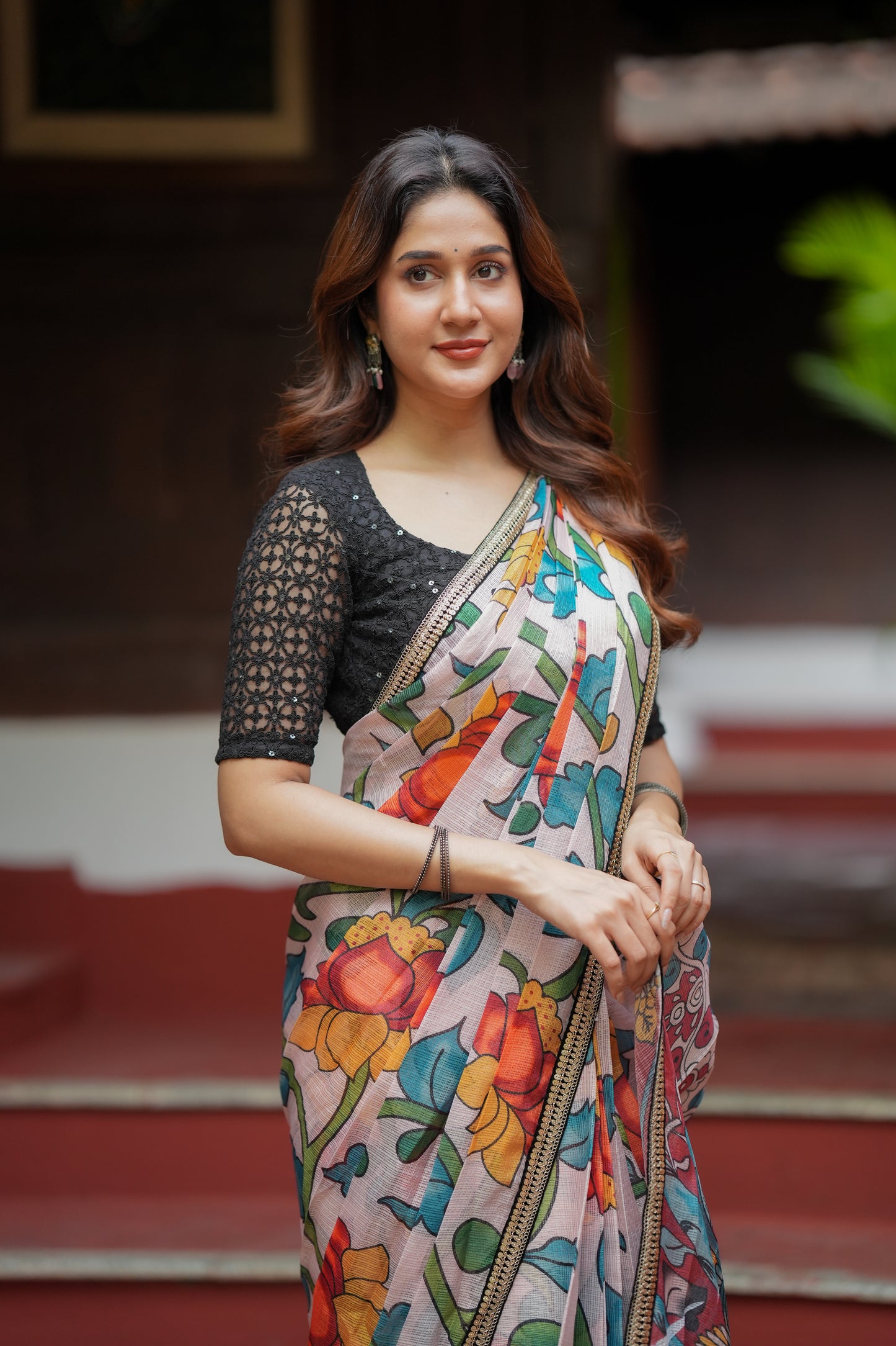 Half white floral kota saree with black embroidered blouse