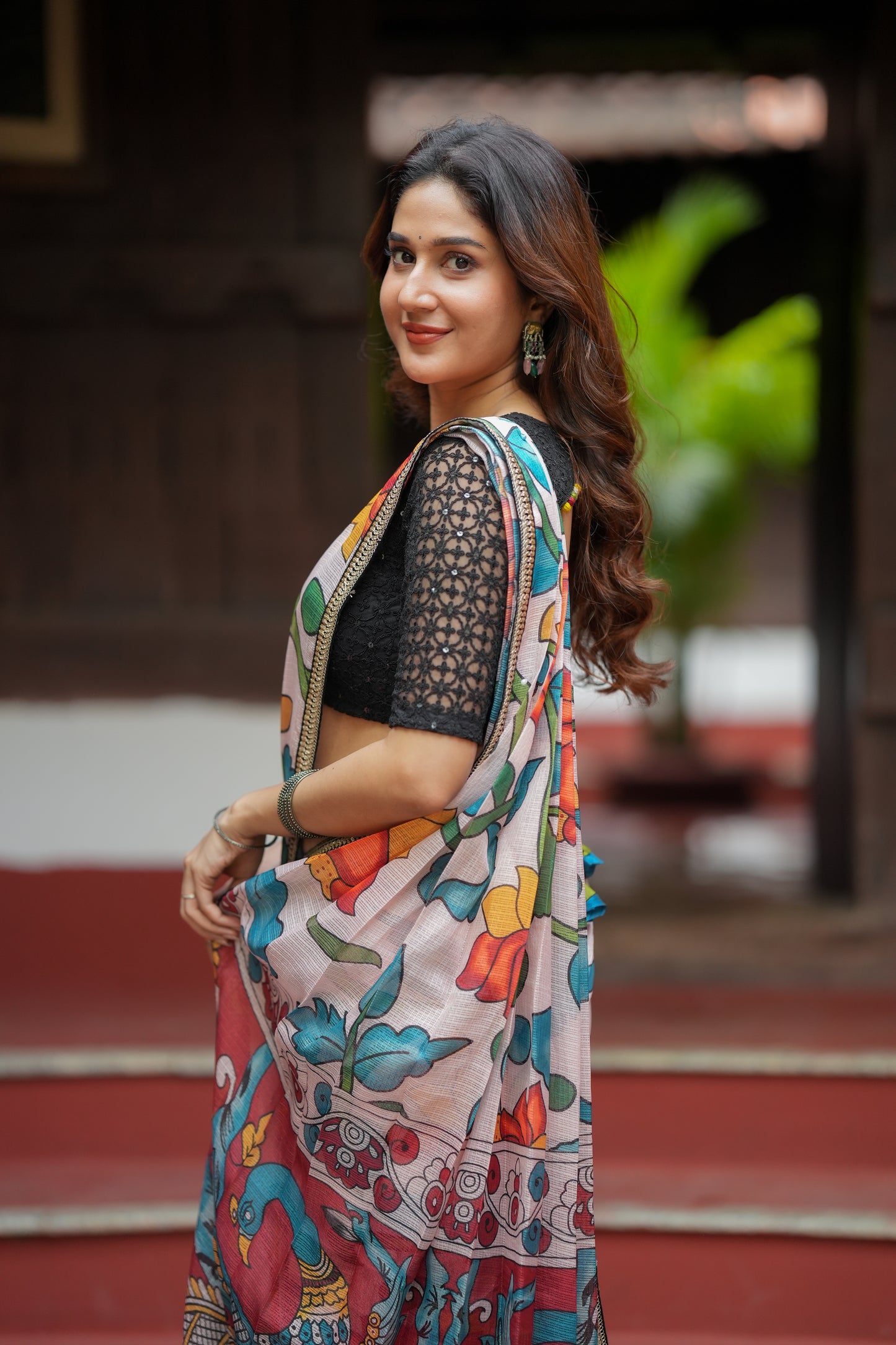 Half white floral kota saree with black embroidered blouse