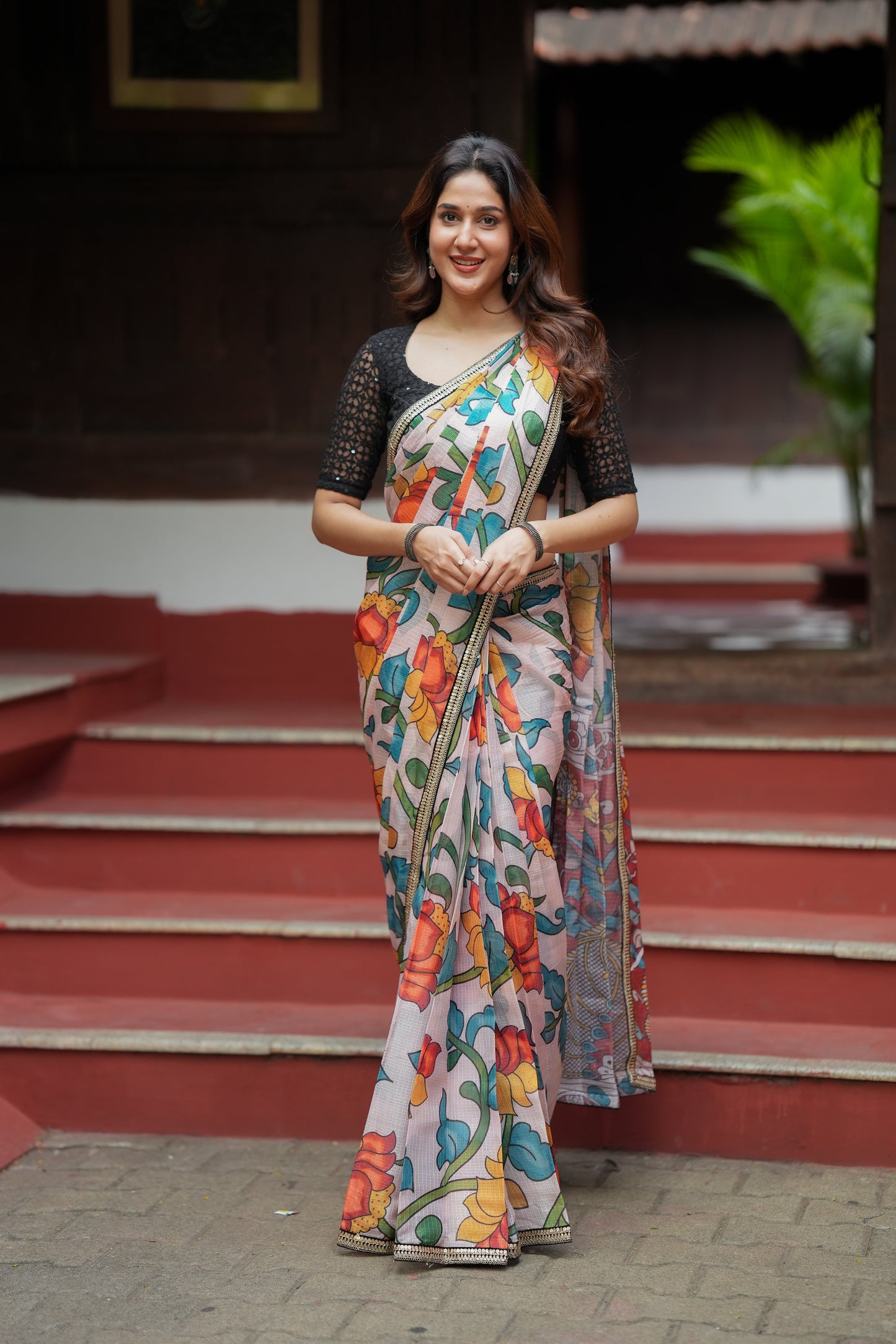 Half white floral kota saree with black embroidered blouse