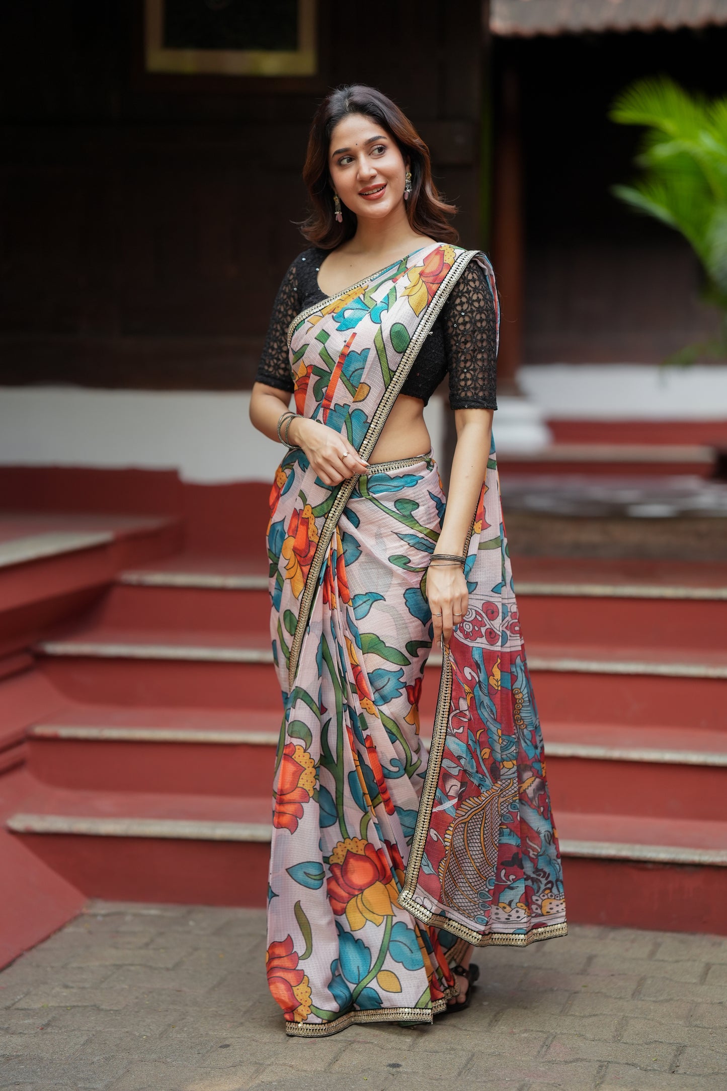 Half white floral kota saree with black embroidered blouse