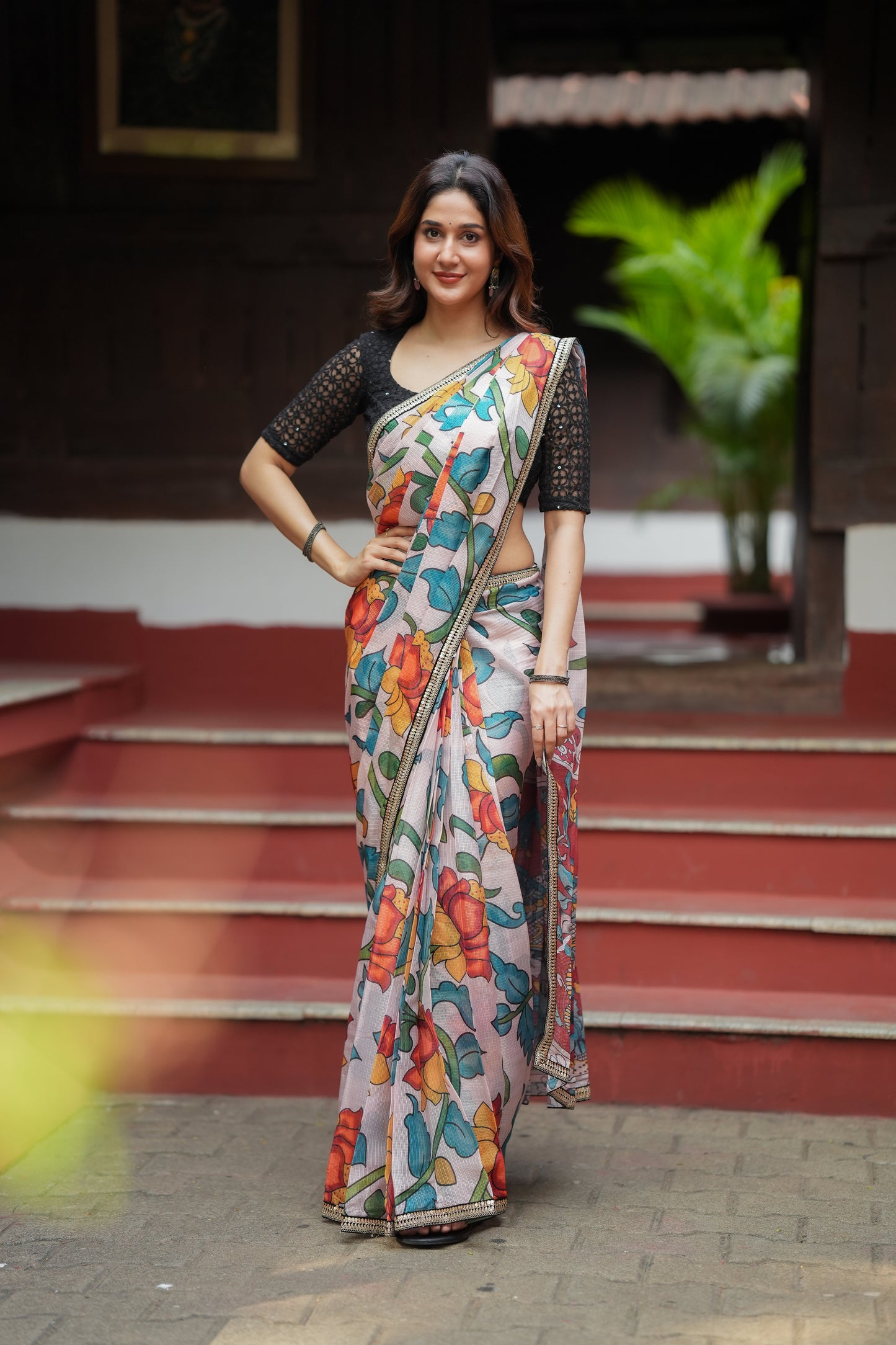 Half white floral kota saree with black embroidered blouse