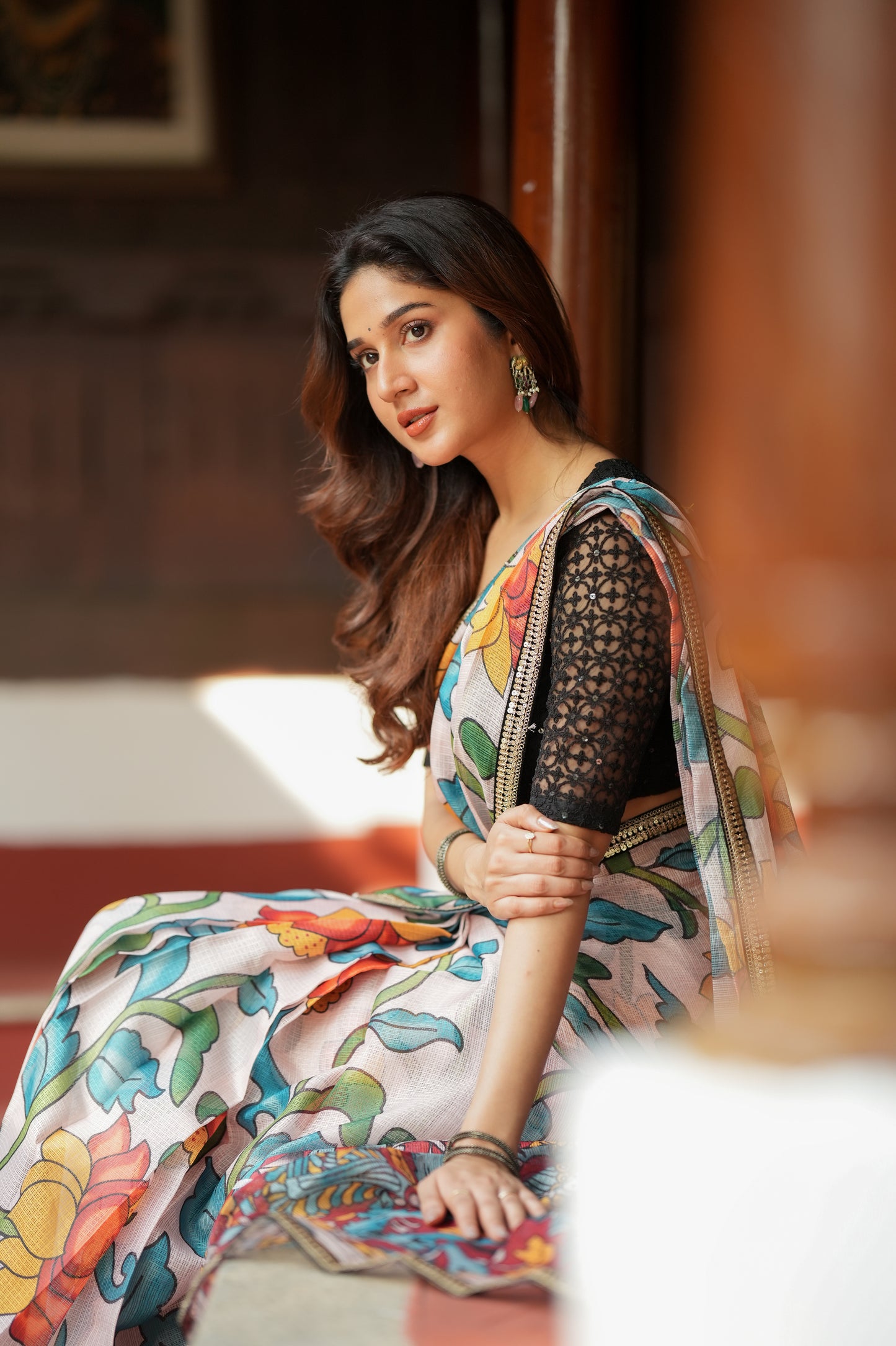 Half white floral kota saree with black embroidered blouse