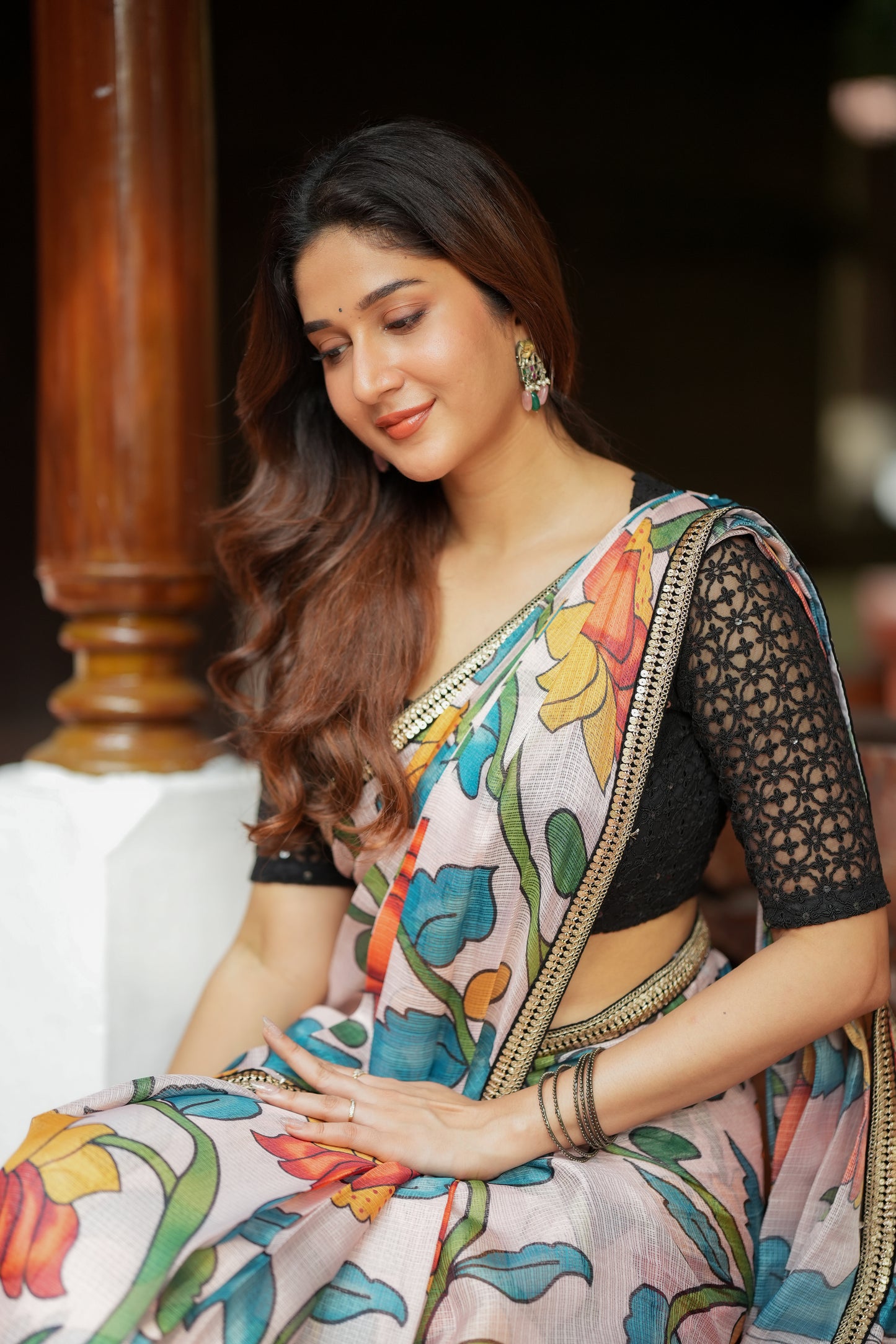 Half white floral kota saree with black embroidered blouse