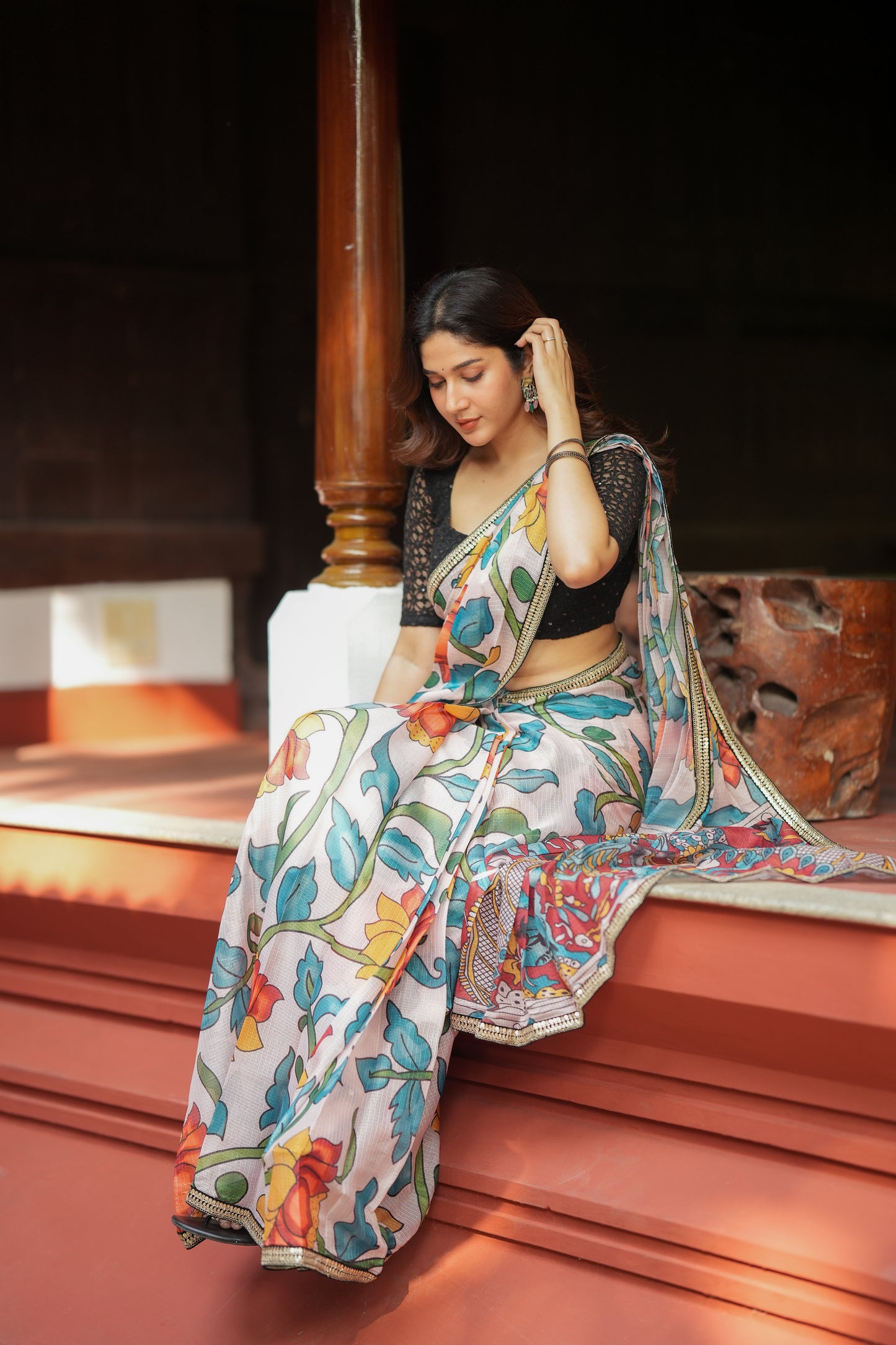 Half white floral kota saree with black embroidered blouse