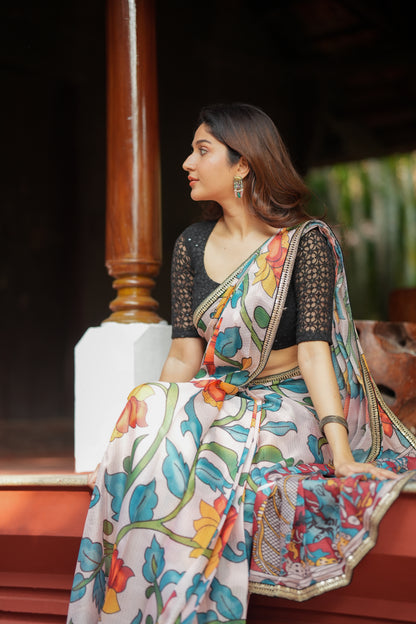 Half white floral kota saree with black embroidered blouse