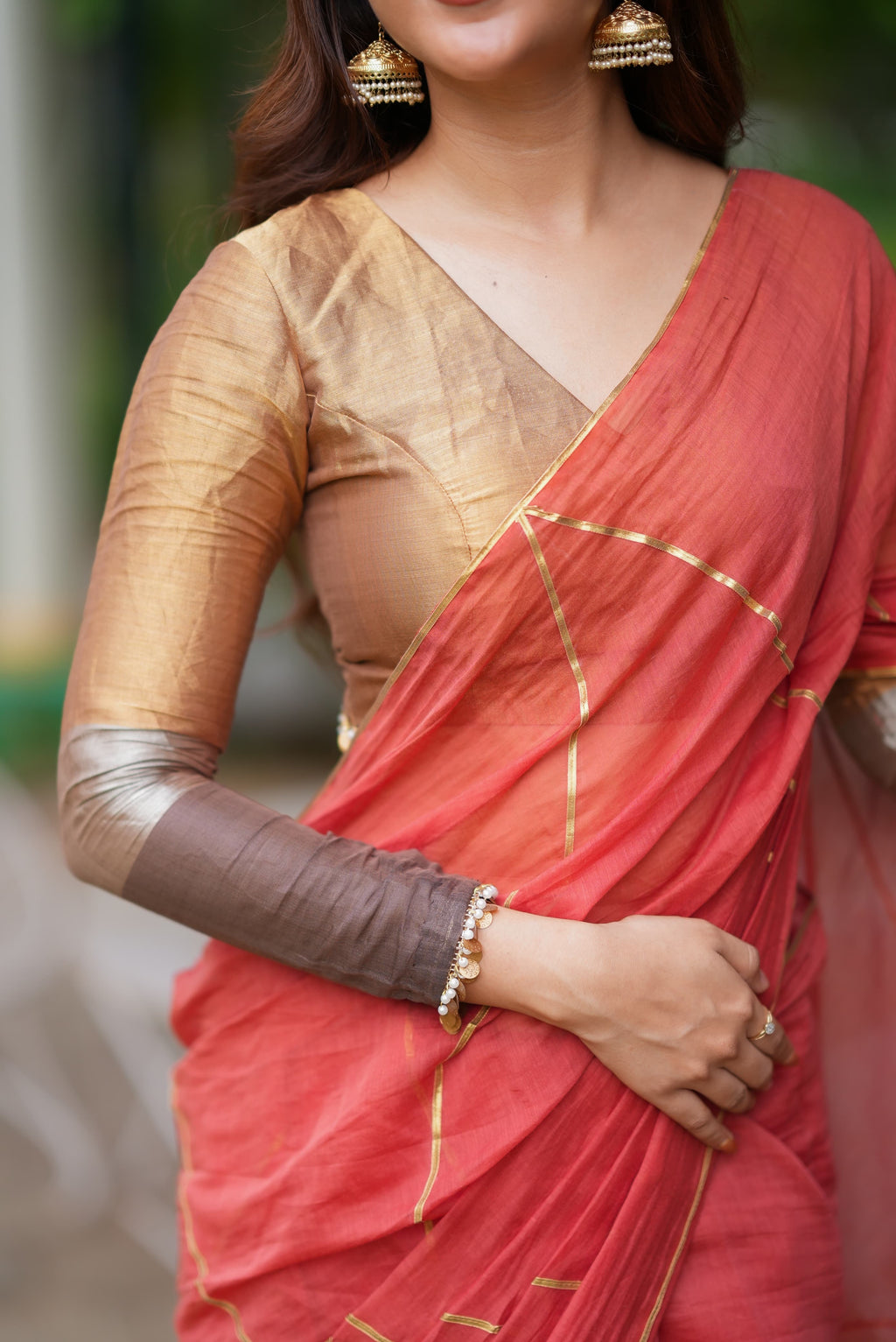 Orange rust saree with tissue handwork blouse