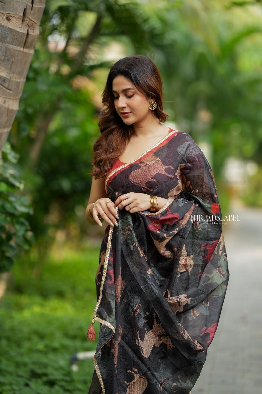 Black cow kota saree with paisley hand work blouse