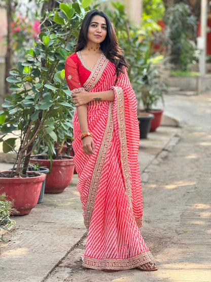 Reddish georgette lehariya saree with handwork blouse