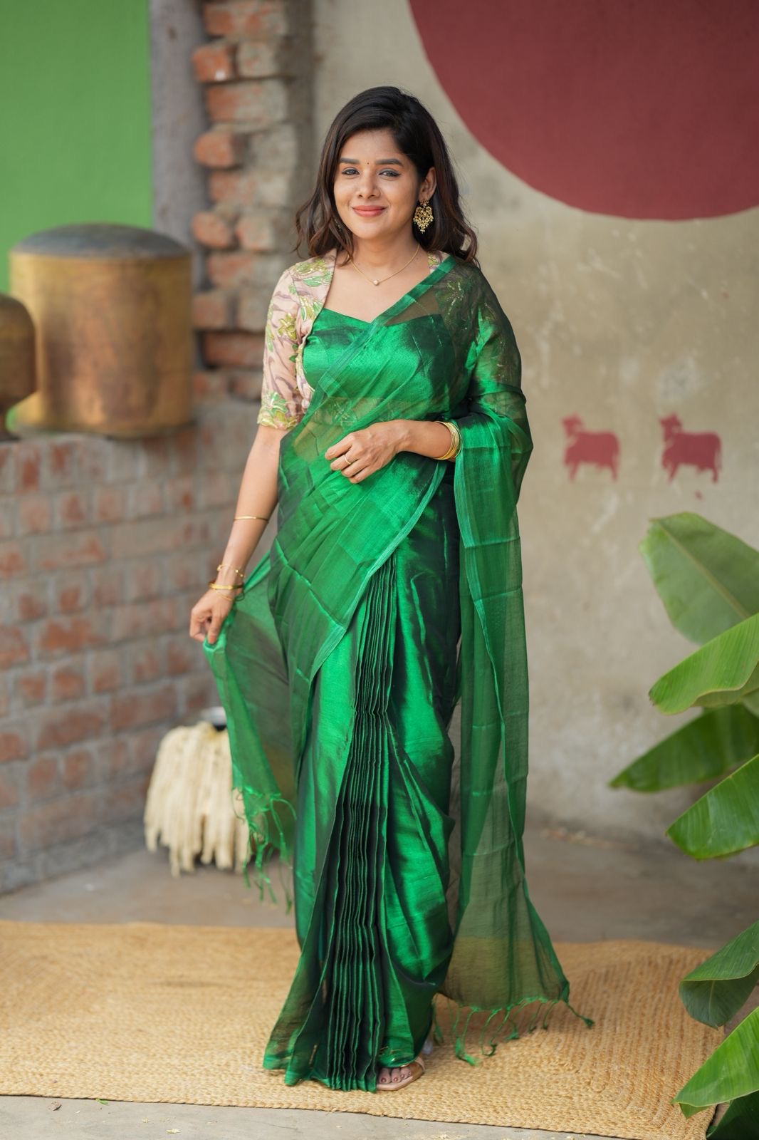 Green soft tissue saree with embroidered blouse