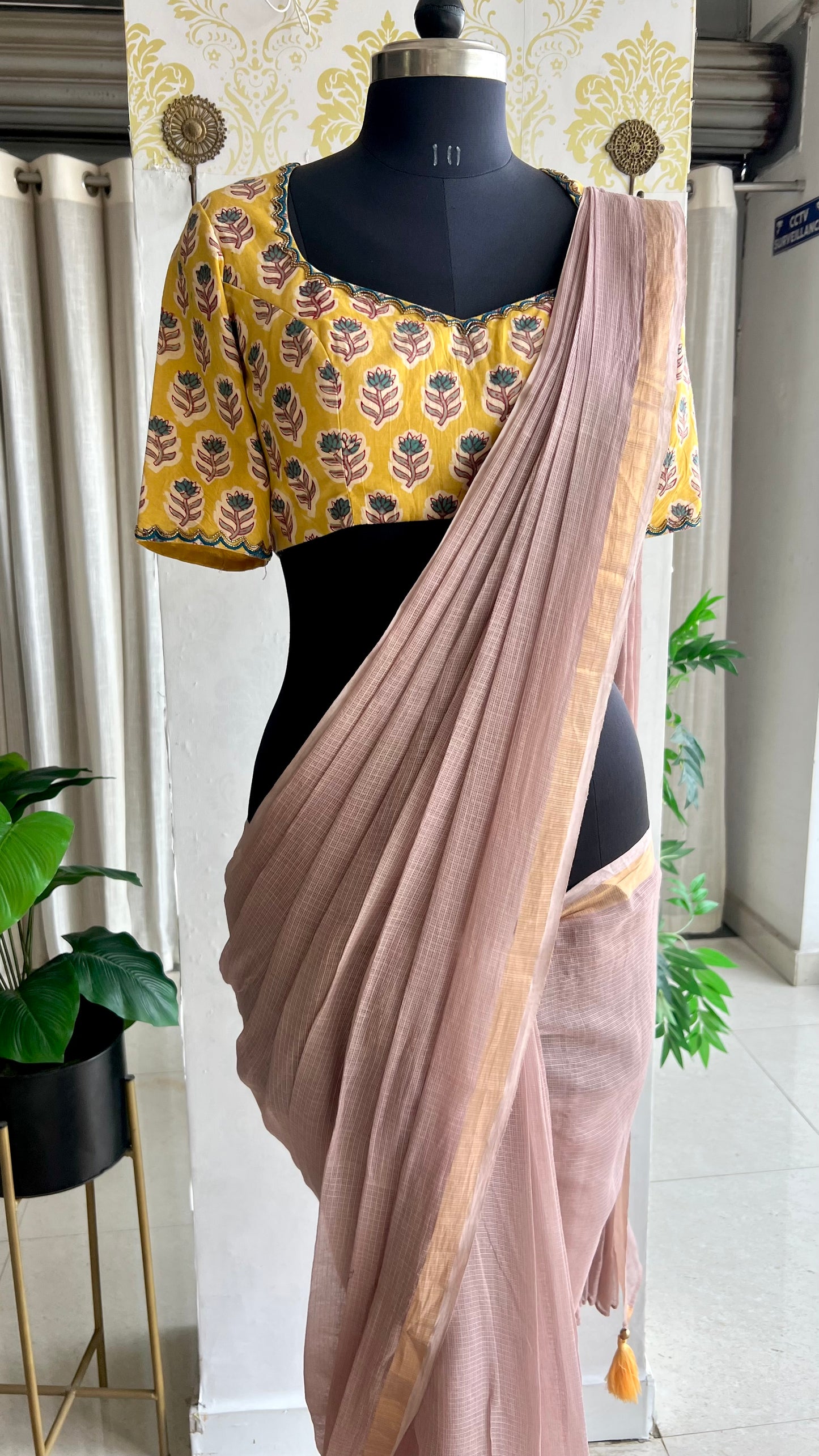 Light peach mul kota saree with yellow hand work blouse