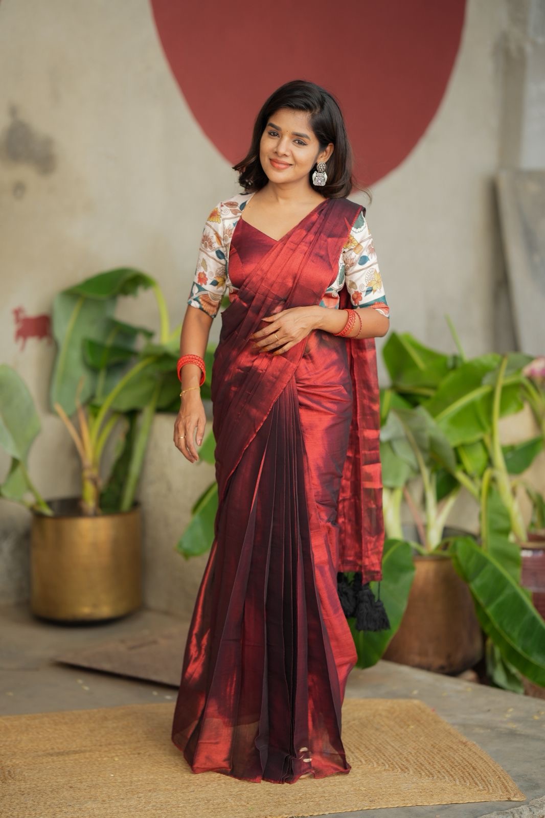 Wine soft tissue saree with floral blouse