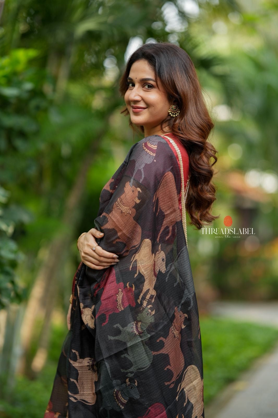 Black cow kota saree with paisley hand work blouse