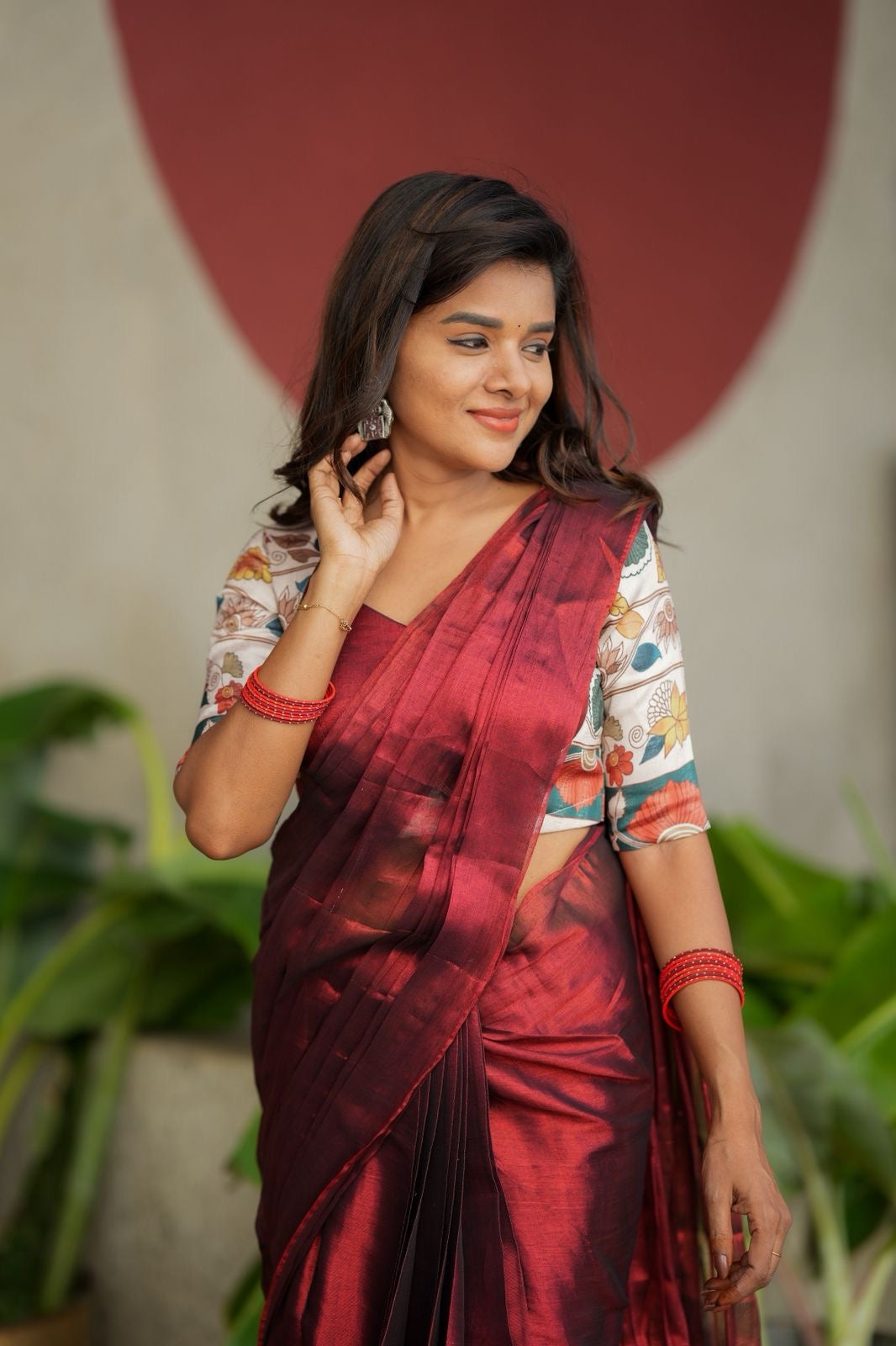Wine soft tissue saree with floral blouse