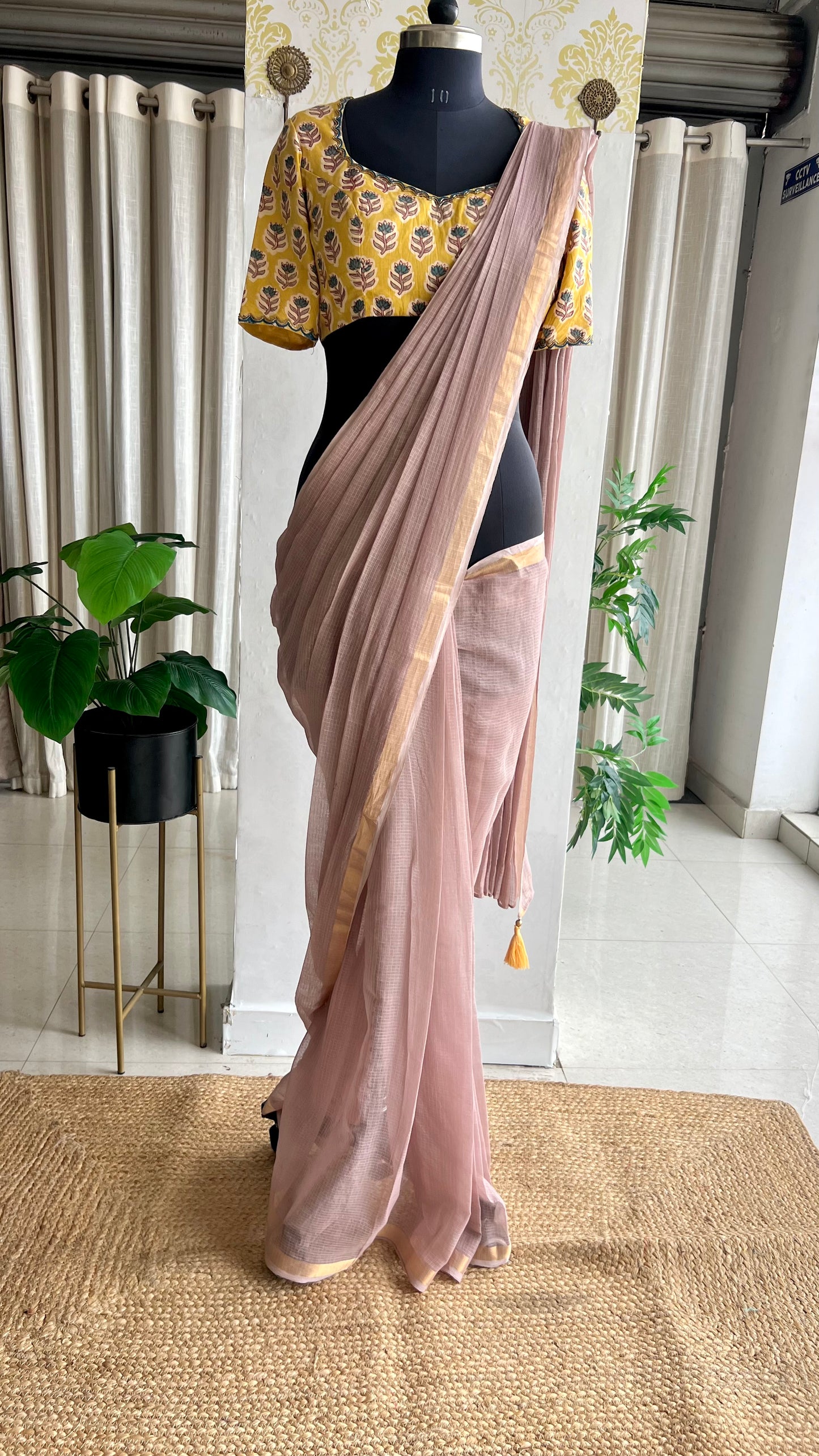 Light peach mul kota saree with yellow hand work blouse