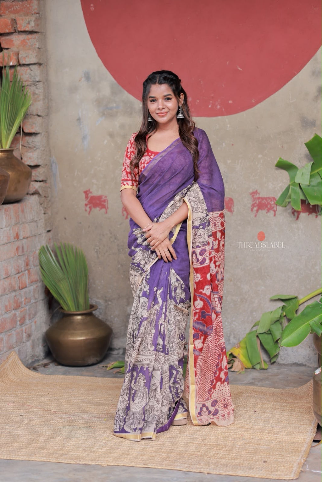 Purple kota saree with kalamkari work blouse