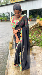 Black georgette saree with floral cotton blouse