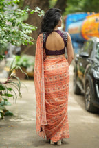 Pastel peach chiffon saree with brown hand work blouse
