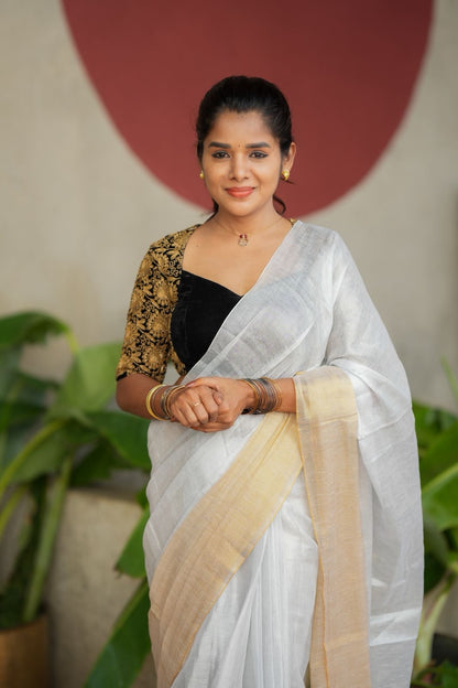 White soft tissue saree with heavy embroidery blouse