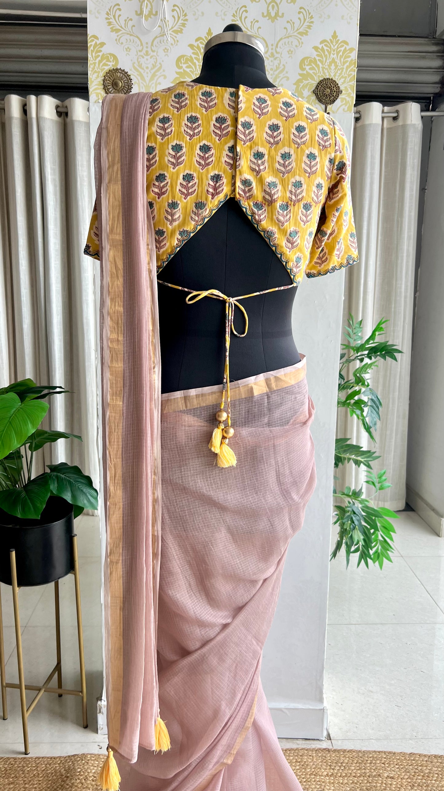 Light peach mul kota saree with yellow hand work blouse