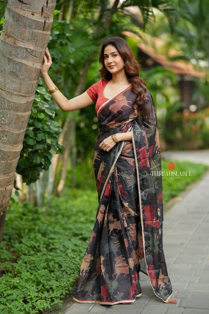 Black cow kota saree with paisley hand work blouse