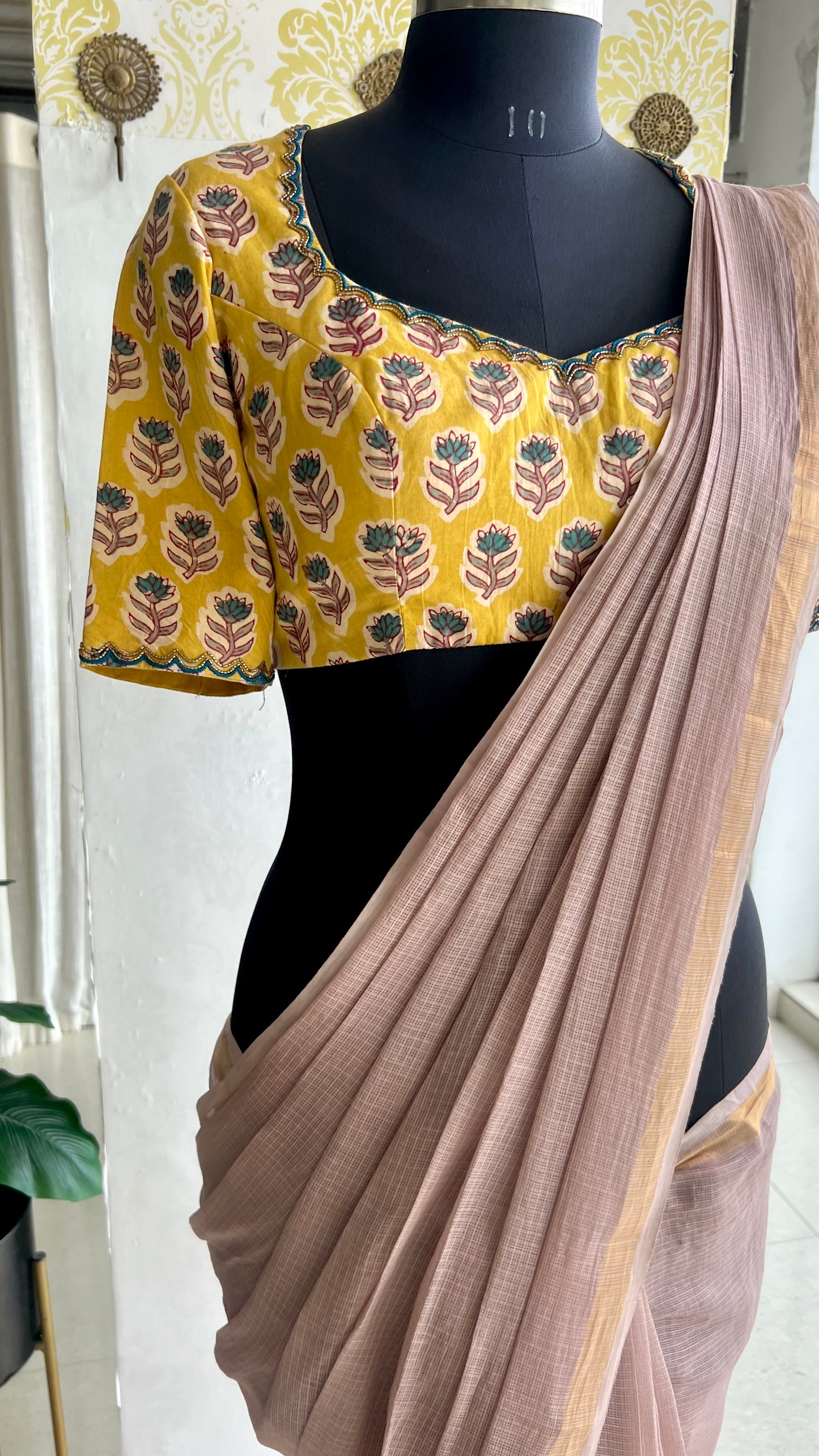 Light peach mul kota saree with yellow hand work blouse