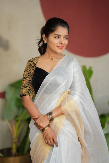 White soft tissue saree with heavy embroidery blouse