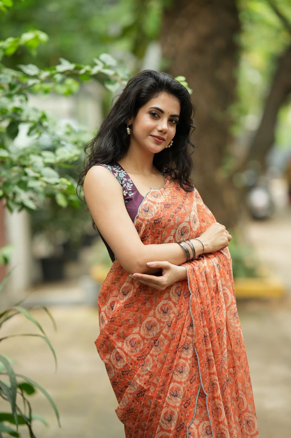 Pastel peach chiffon saree with brown hand work blouse