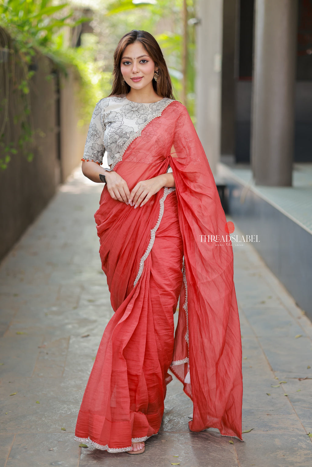Orange rust saree with pearl work blouse