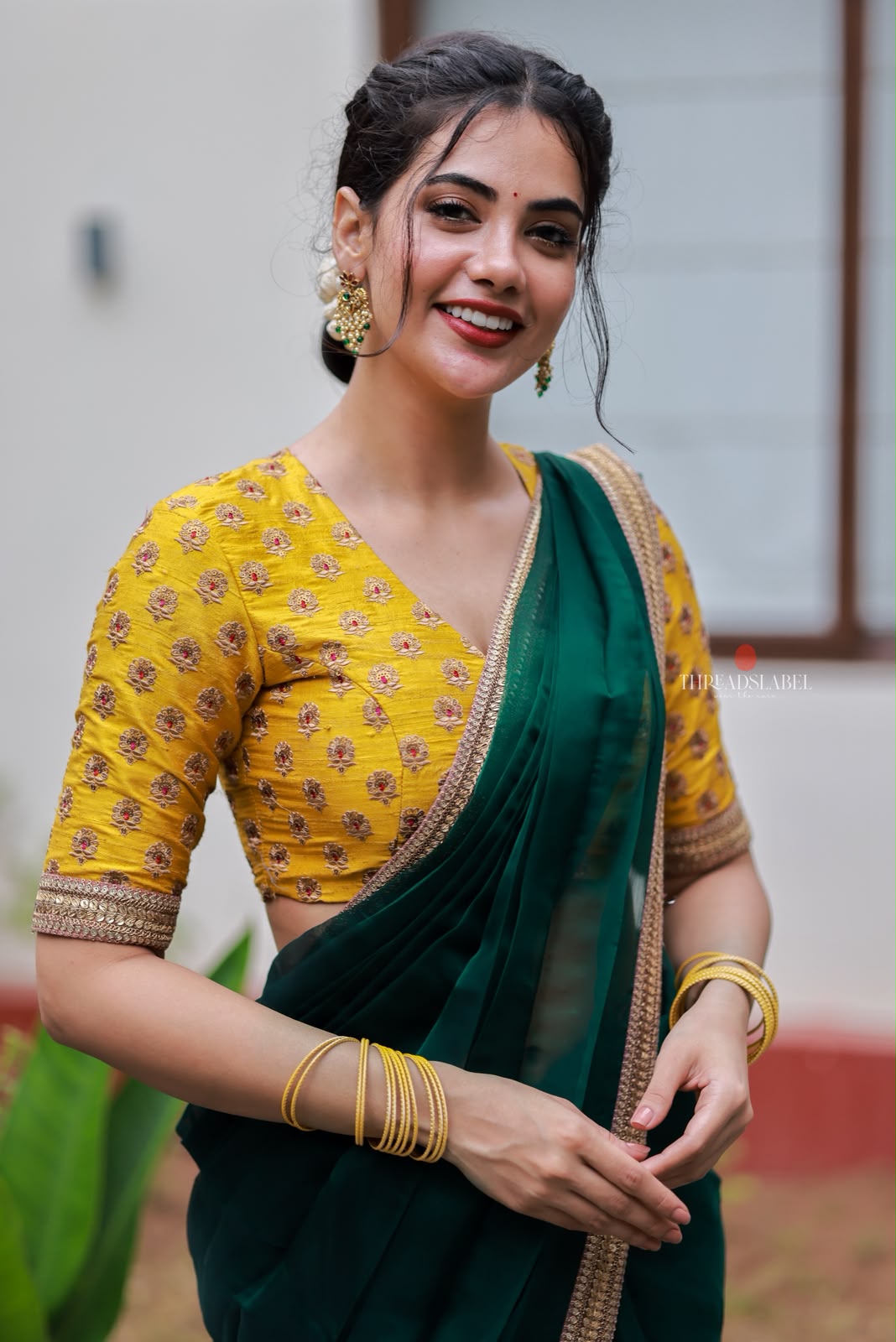 Green organza saree with yellow hand work blouse