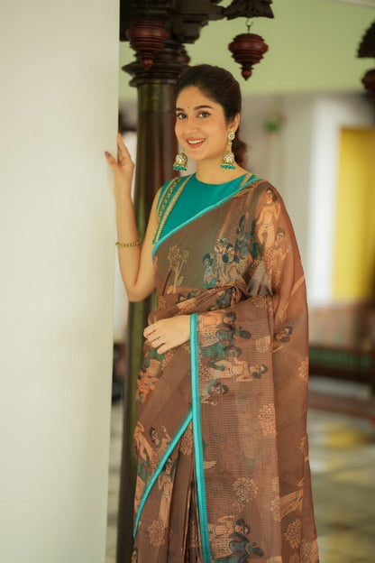 Brown kalamkari kota saree with blue hand work blouse