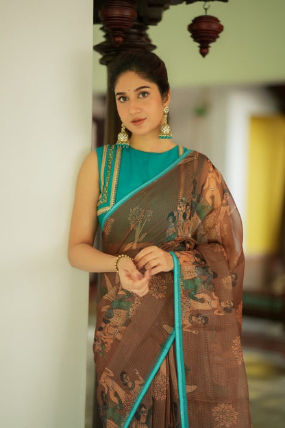 Brown kalamkari kota saree with blue hand work blouse