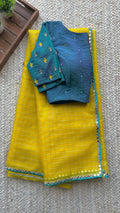 Yellow organza checked saree with handwork blouse