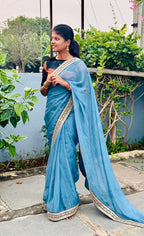 Blue organza saree with stripe velvet blouse