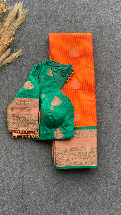 Orange and green silk saree with hand work blouse