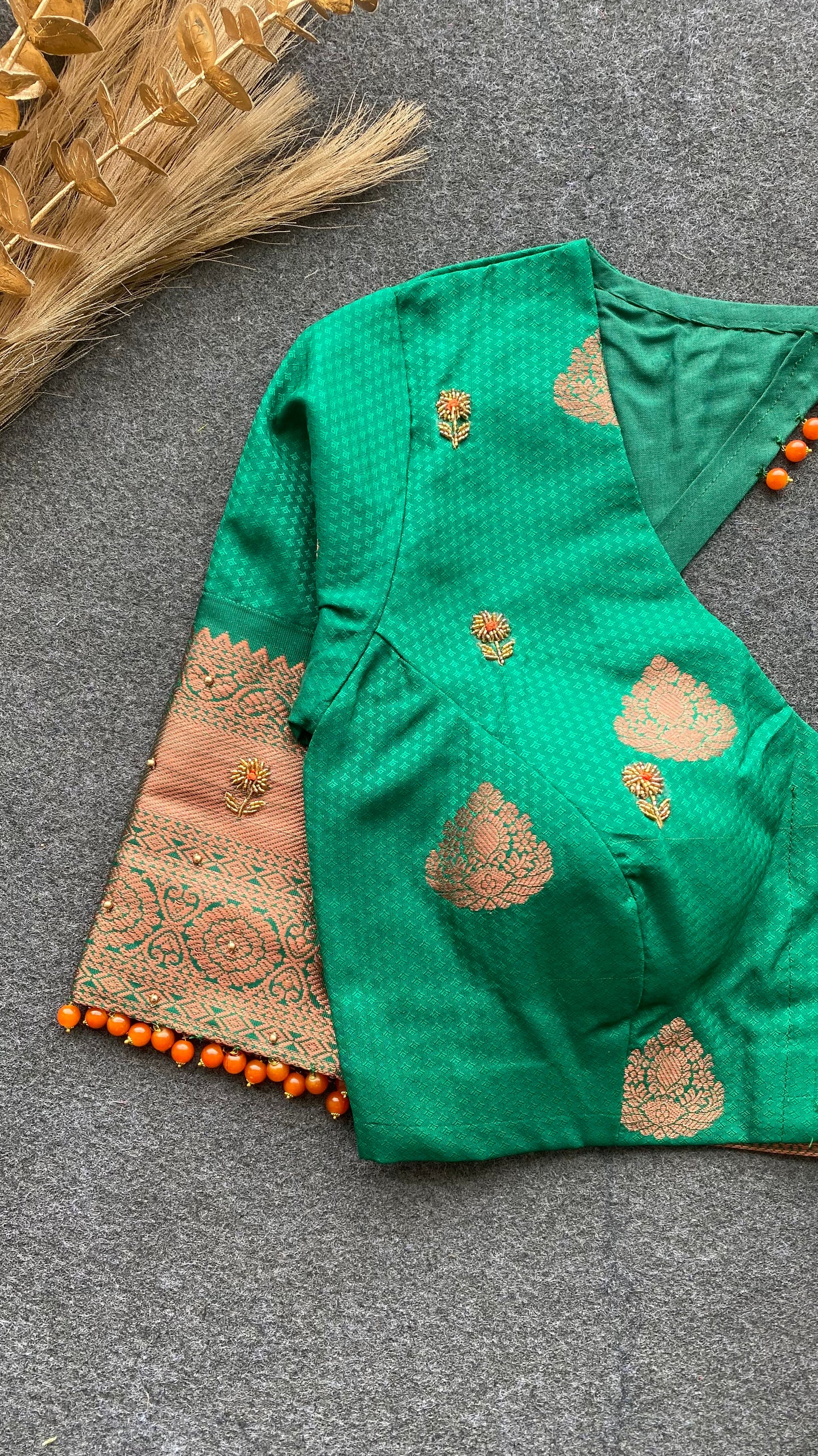 Orange and green silk saree with hand work blouse