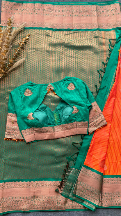 Orange and green silk saree with hand work blouse