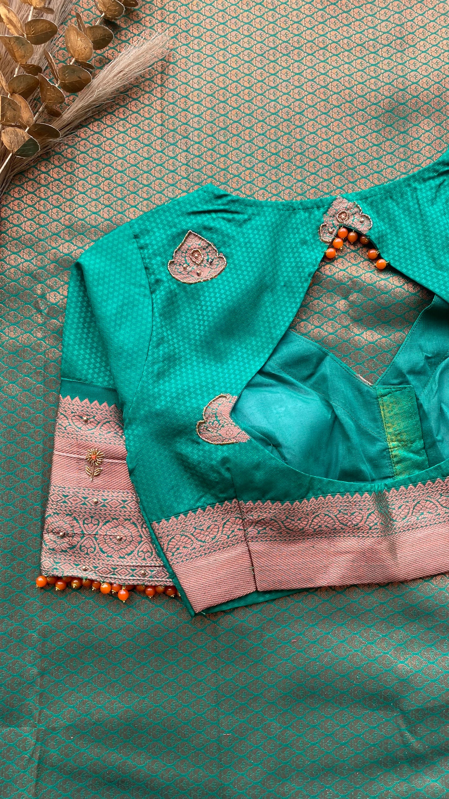 Orange and green silk saree with hand work blouse