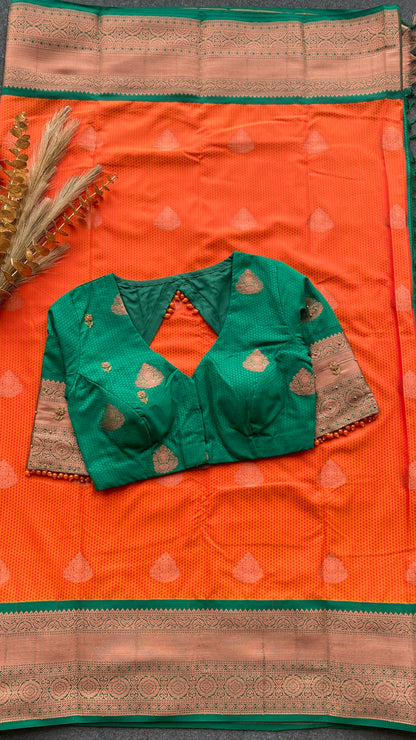 Orange and green silk saree with hand work blouse