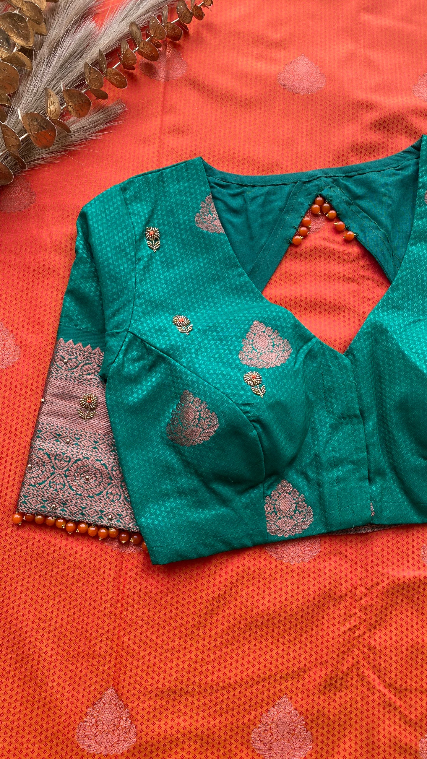 Orange and green silk saree with hand work blouse